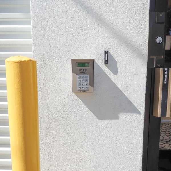 Keypad at the entrance to StorQuest Express Self Service Storage in Tampa, Florida
