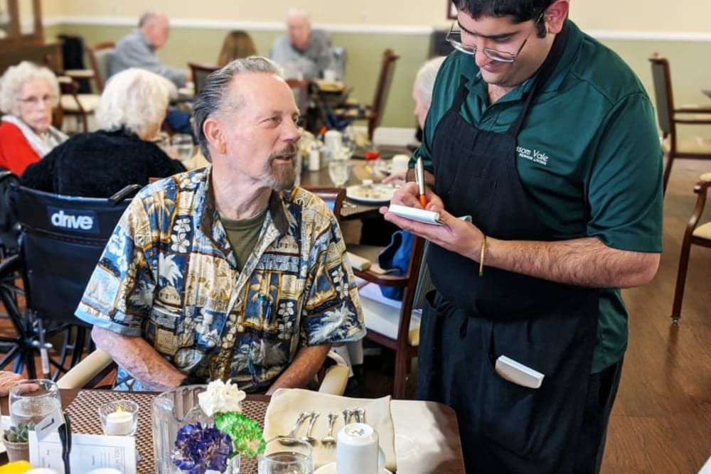 A resident dining at Blossom Vale Senior Living in Orangevale, California.