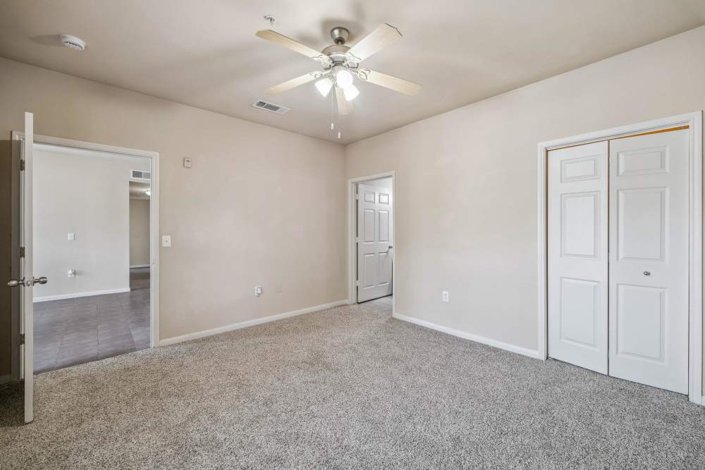 Primary bedroom with ample natural light at Atascocita Pines in Humble, Texas