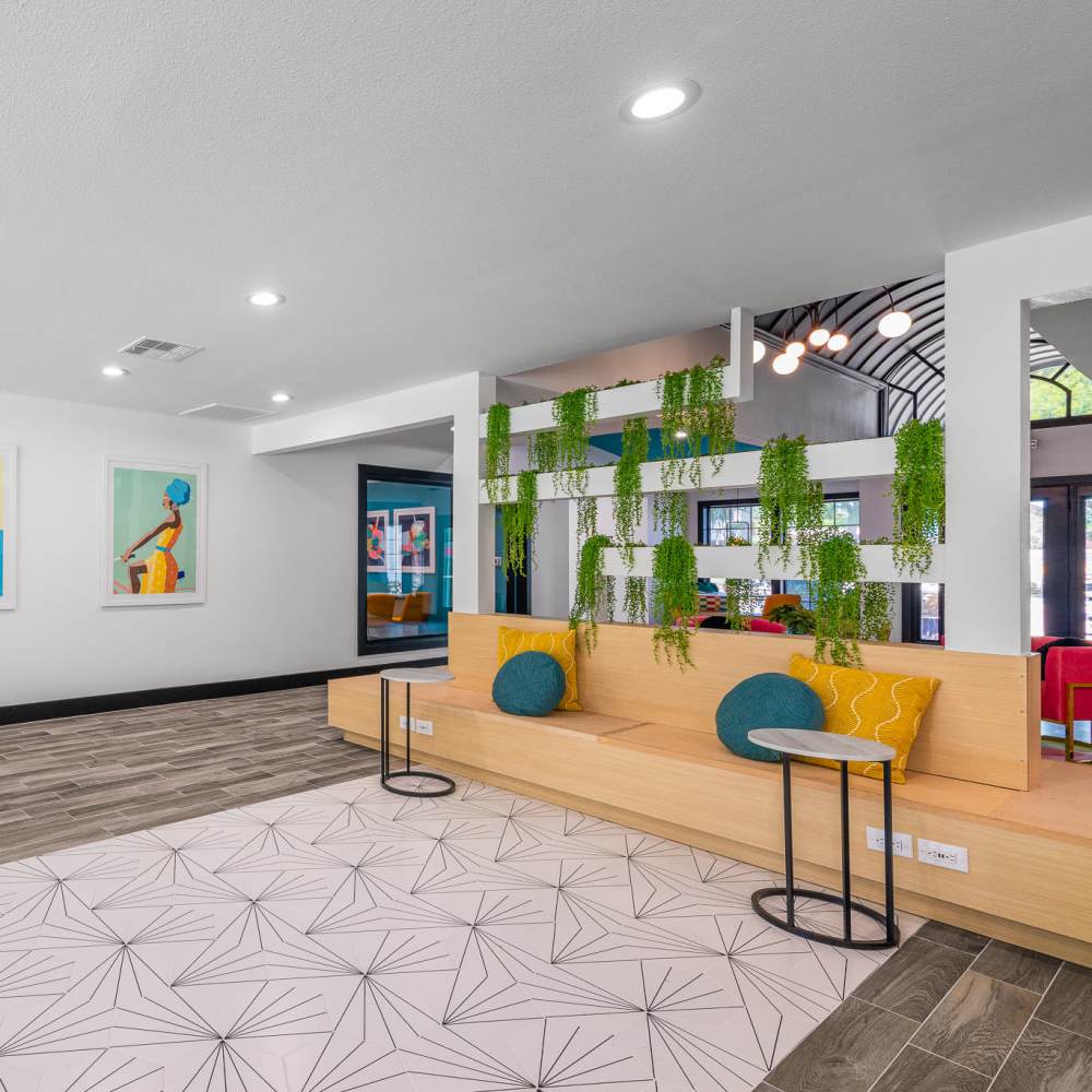 Modern lounge area with vibrant artwork at Sagamore Apartments in Benbrook, Texas
