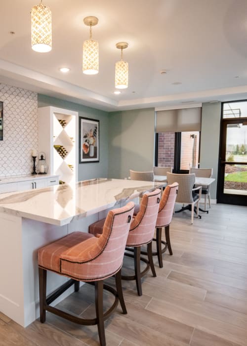 Community lounge with counter seating and marble countertops at The Pillars of Lakeville in Lakeville, Minnesota