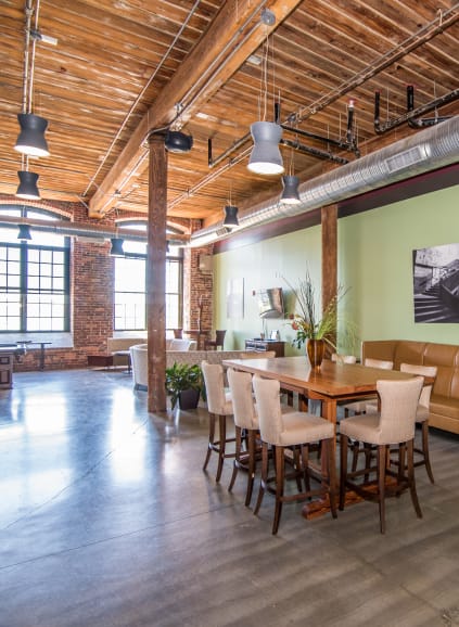 Large fitness center with heavy free weights and other modern workout equipment at Loray Mill Lofts in Gastonia, North Carolina