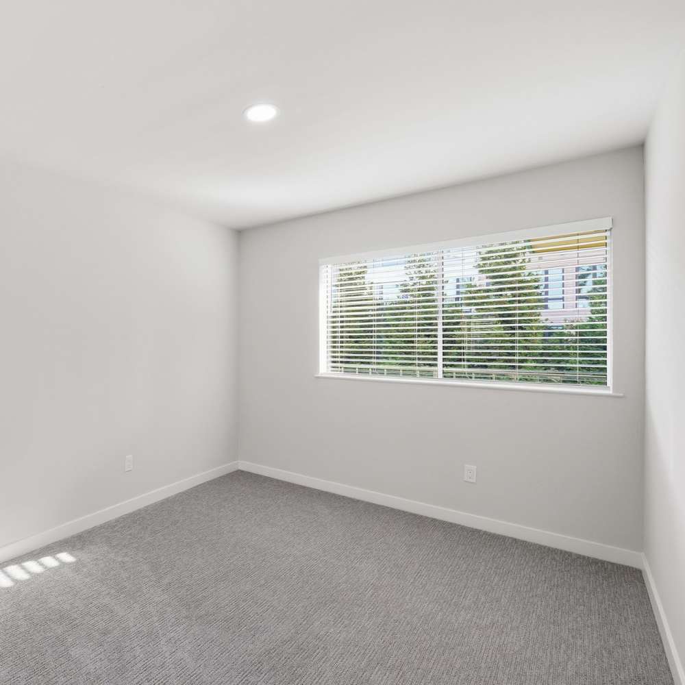Bedroom with plush carpet at Fayette Arms Apartments in Mountain View, California, 