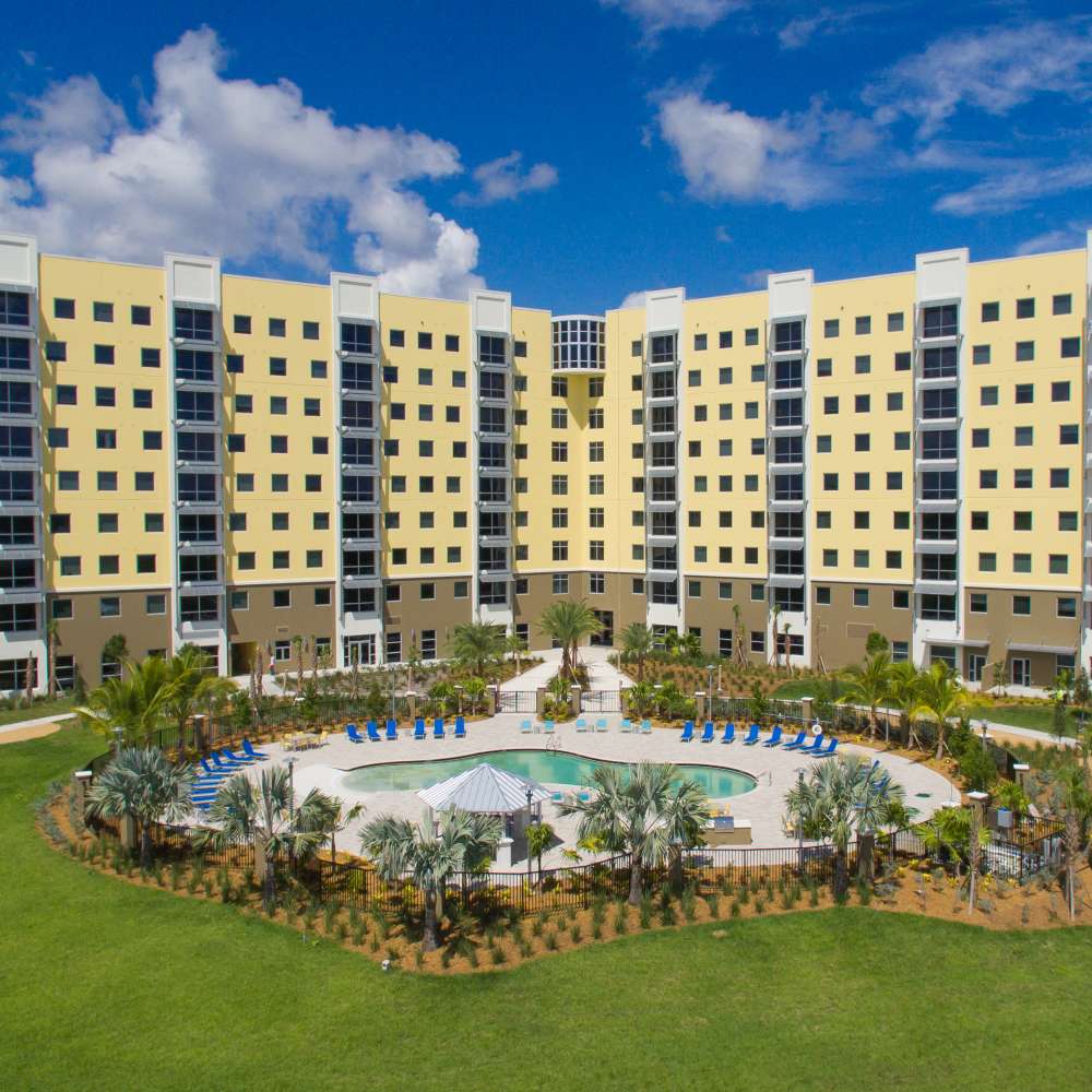 Sparkling pool surrounded by landscaped grounds at Bayview Student Living in North Miami, Florida