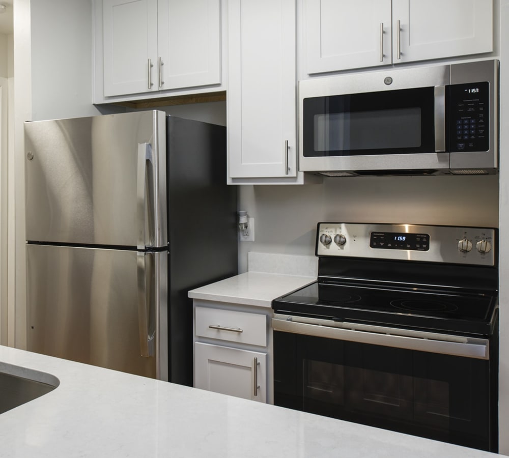 Stainless steel appliances in an apartment kitchen at Stonecreek Club in Germantown, Maryland