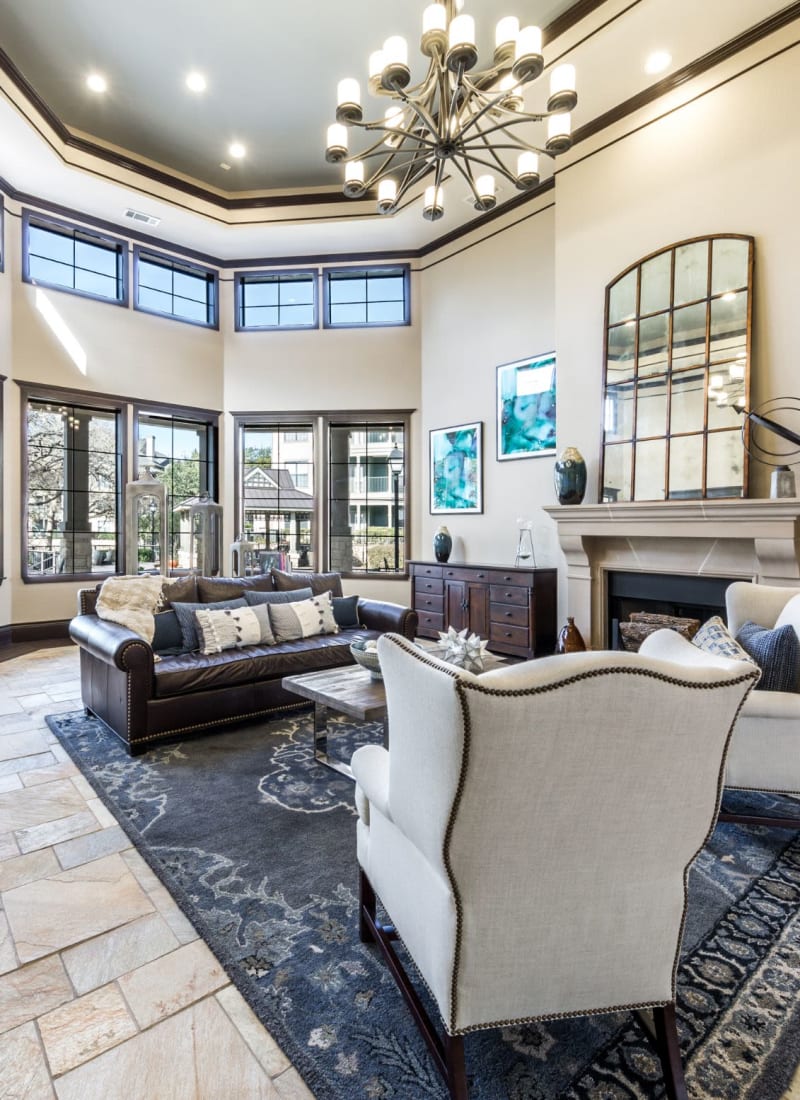 Lobby entrance with sitting area and multiple large windows at The Marquis at Brushy Creek in Austin, Texas