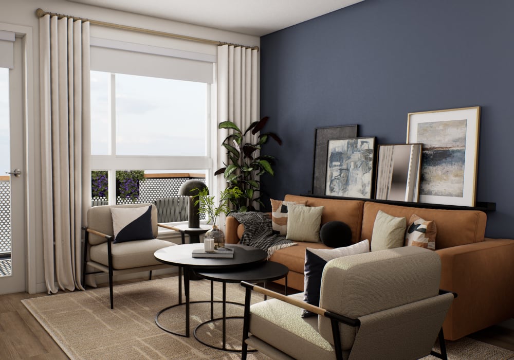 Modern living room with arm chairs, sofa and artwork at The Colton in Redwood City, California