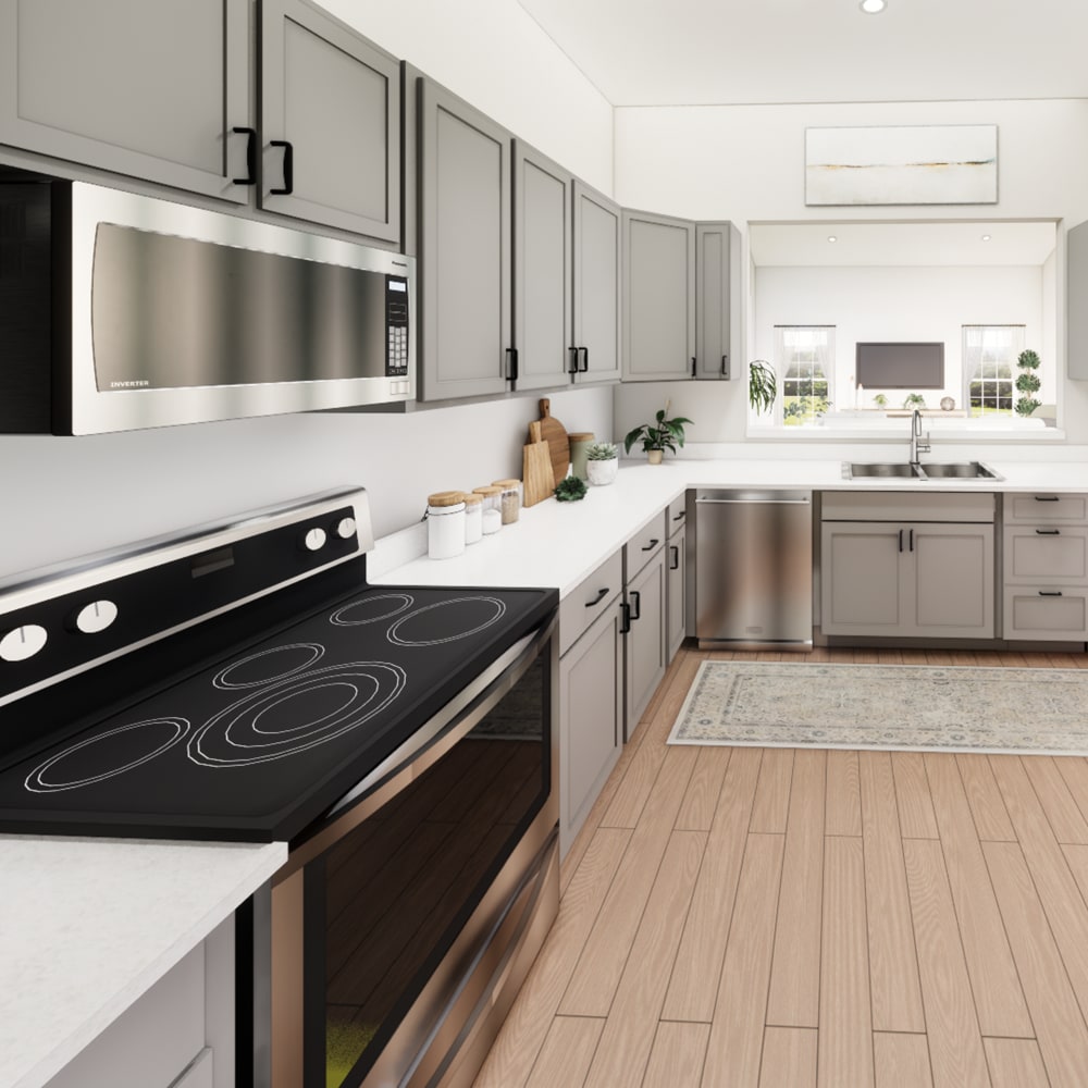 Spacious kitchen with stainless-steel appliances and wood-style flooring at The Pointe at Loudon in Loudon, Tennessee