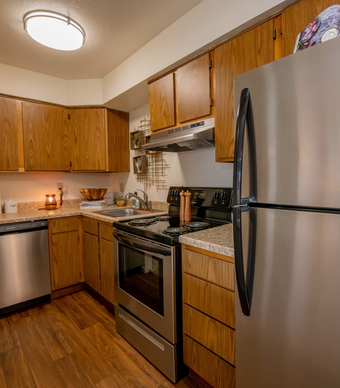 Kitchen with granite countertops at Council Place Apartments in Oklahoma City, Oklahoma