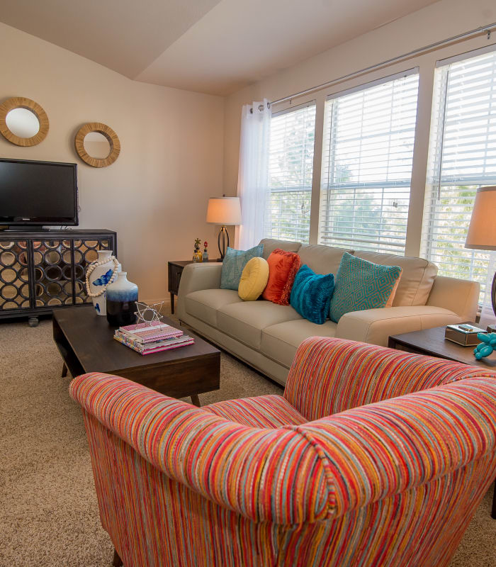 Spacious living room with large windows at Villas at Aspen Park in Broken Arrow, Oklahoma
