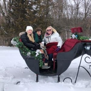 Resident Elizabeth gets a sleigh ride at Garnett Place in Cedar Rapids, Iowa.