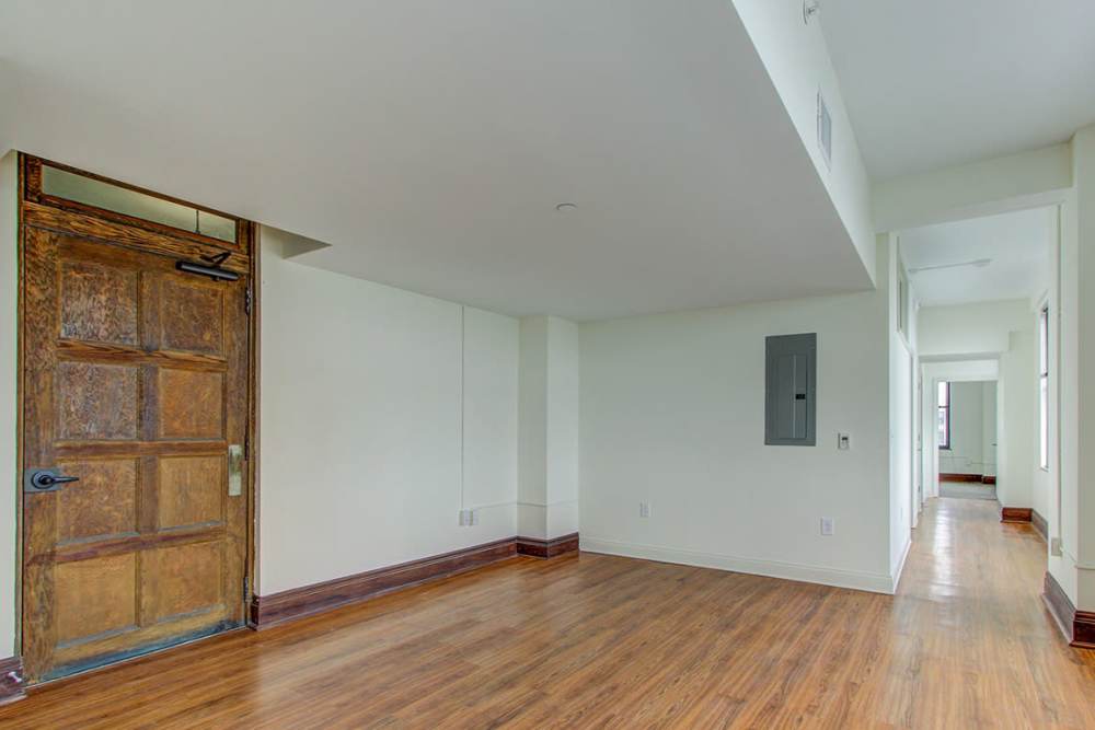 Spacious open layout with wood-style flooring at 43 Town Square in Lima, Ohio