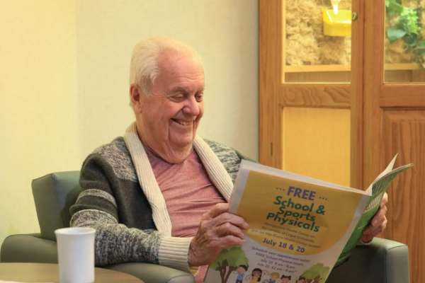 residents reading the paper at O'Fallon in O'Fallon, MO