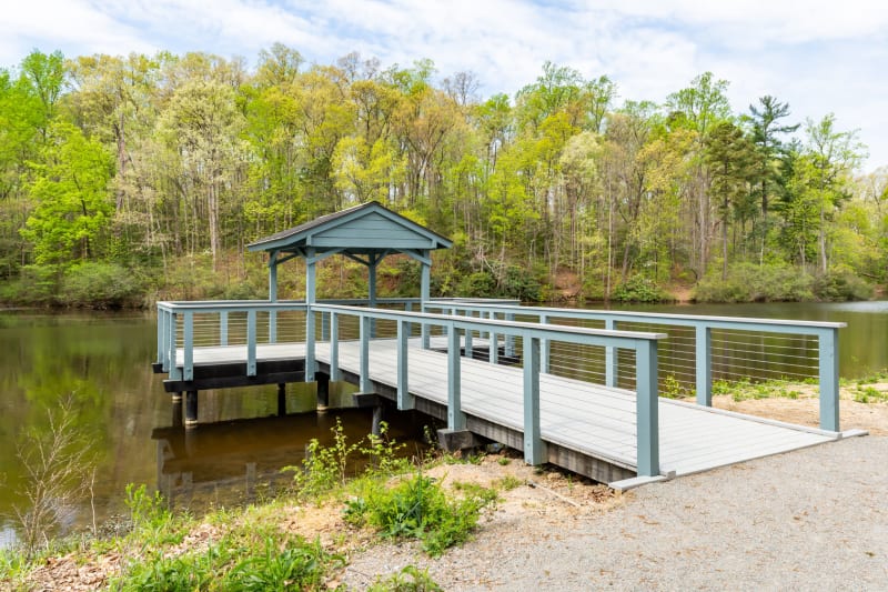 Pier and walking trail on the tranquil lake at Boulders Lakeside in North Chesterfield, Virginia
