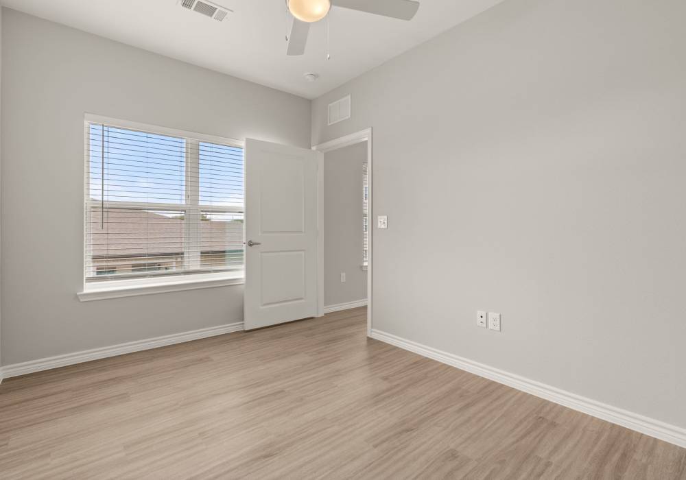 Bright bedroom with natural light at Walnut Springs in Seguin, Texas