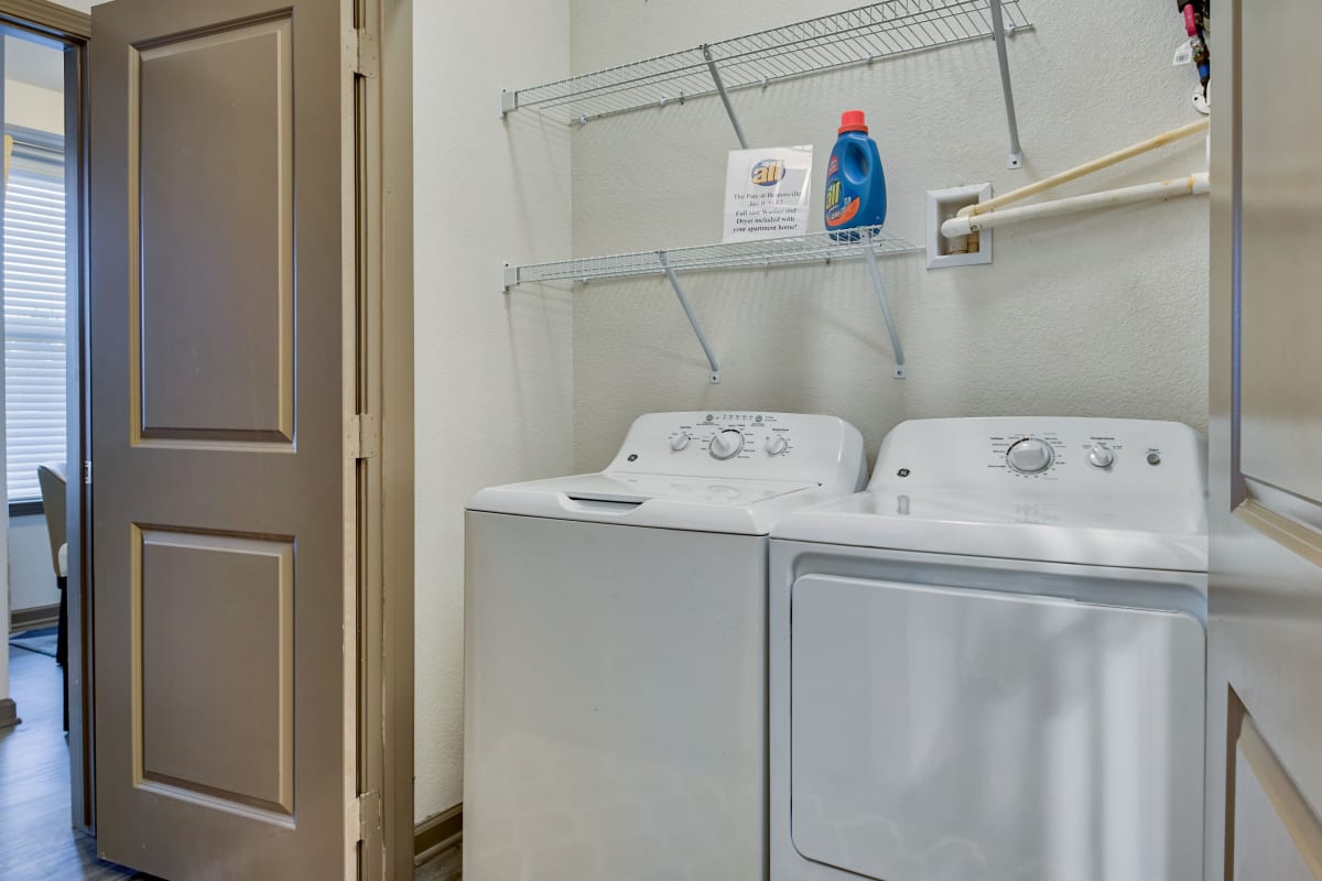 Washer and dryer in an apartment at Parc at Bentonville in Bentonville, Arkansas