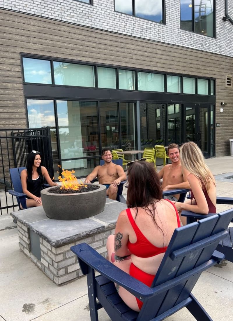 Residents gathered around the firepit at Marq Promenade in Westminster, Colorado