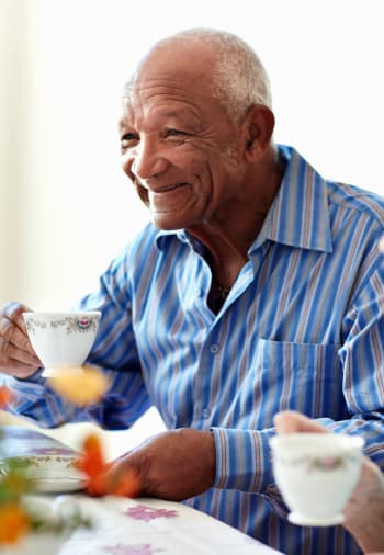 A resident drinking coffee at The Claiborne at Newnan Lakes in Newnan, Georgia.