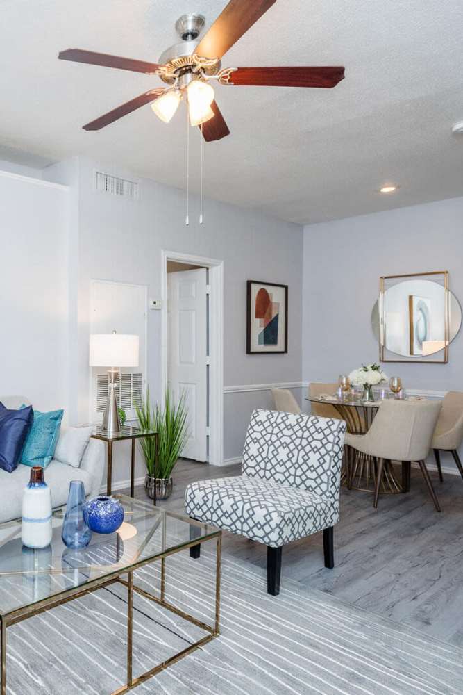 Living room with wood-style flooring at Green Tree Place in Houston, Texas