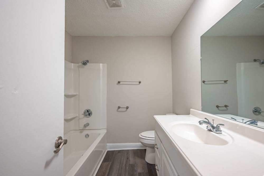 Bathroom with vanity mirror at Ivey Ridge Apartments in Graham, North Carolina