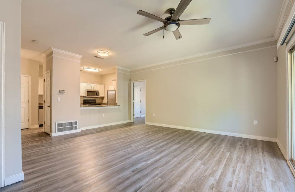 Open-concept of kitchen and living room at Creekwood Place in Lancaster, Texas