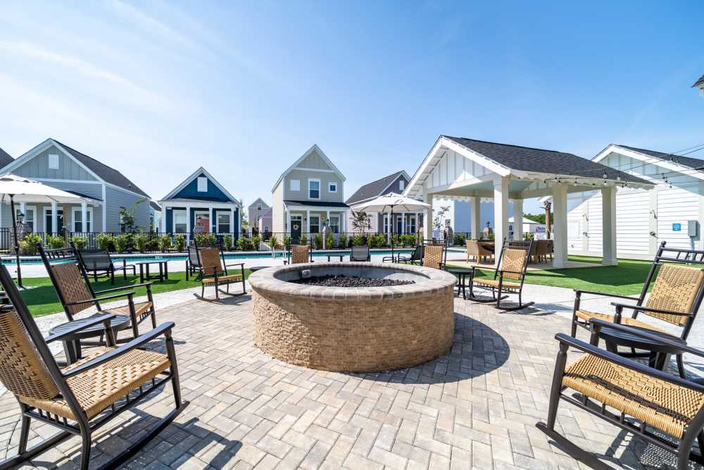 Fireplace with chairs and connecting swimming pool at Seaglass Cottage in North Myrtle Beach, South Carolina
