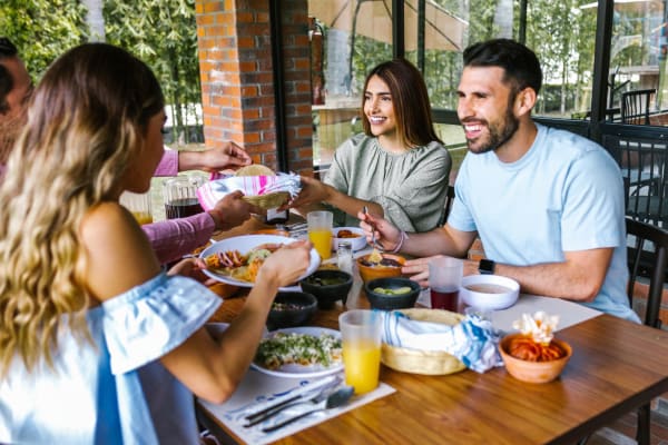 A group of friends enjoying food at a restaurant near Haven Hill Exchange in Atlanta, Georgia