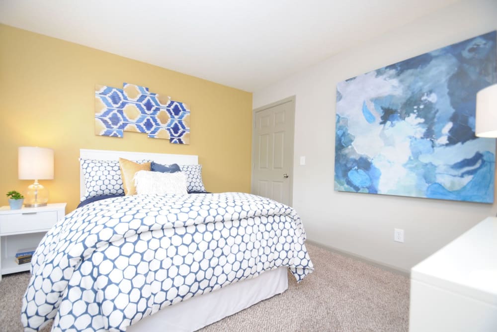 Naturally lit bedroom with lovely art decor at Goldelm at The Views in Asheville, North Carolina