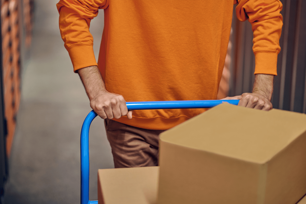 A customer moving boxes to his unit at BuxBear Storage Tulsa in Tulsa, Oklahoma