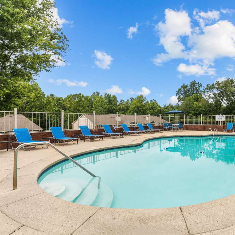 Pool with sun loungers at Cannongate Apartments in Vicksburg, Mississippi