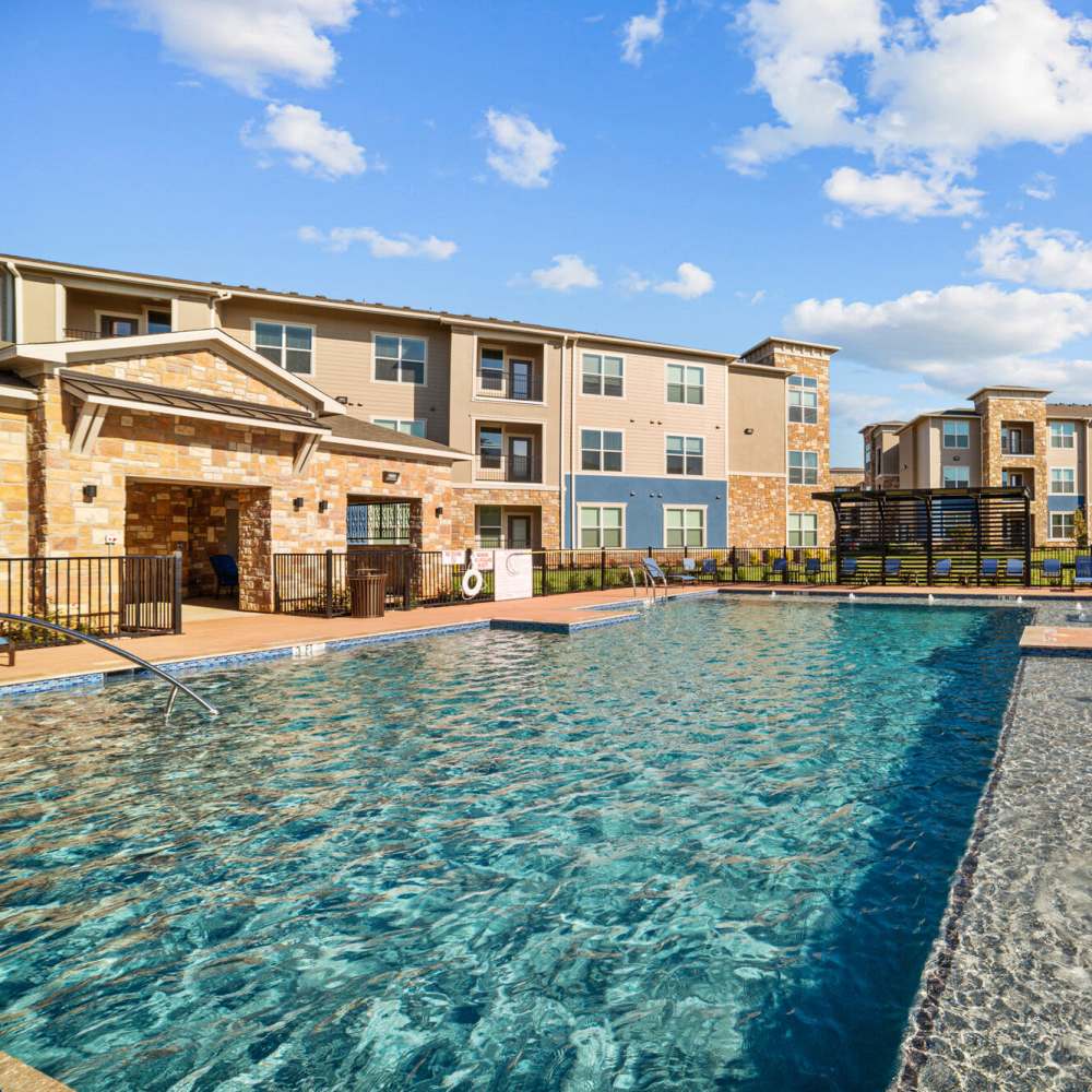 Swimming pool with lounge beds at Brook Hollow in Wichita Falls, Texas