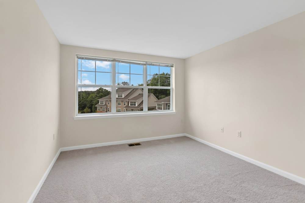 Bedroom with large windows at Robinson Overlook in Columbia, Maryland