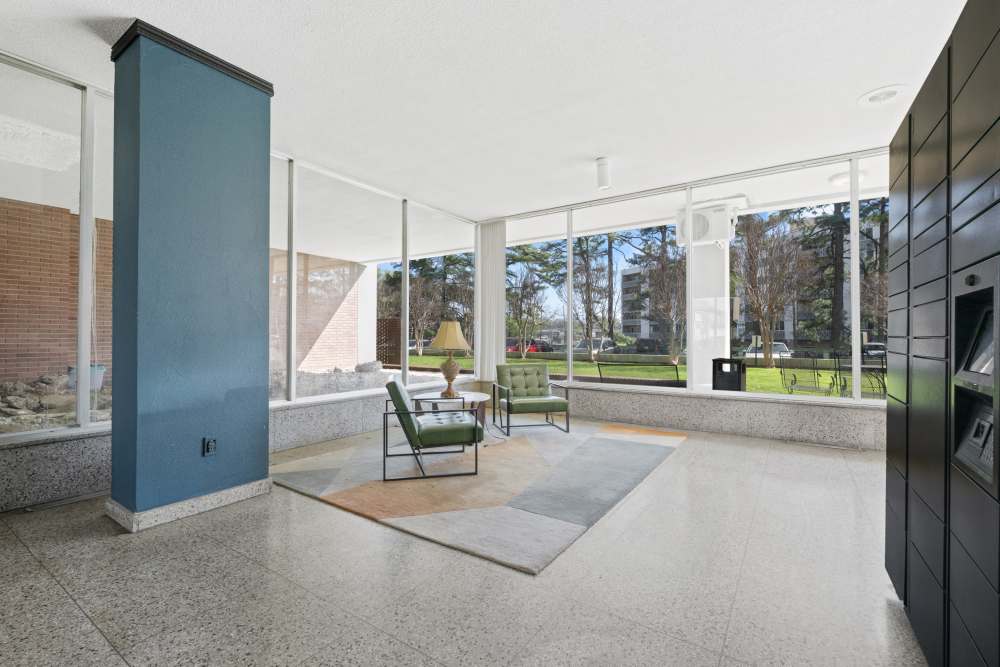 Well-lit clubhouse with social space and large windows at Central Gardens in Memphis, Tennessee
