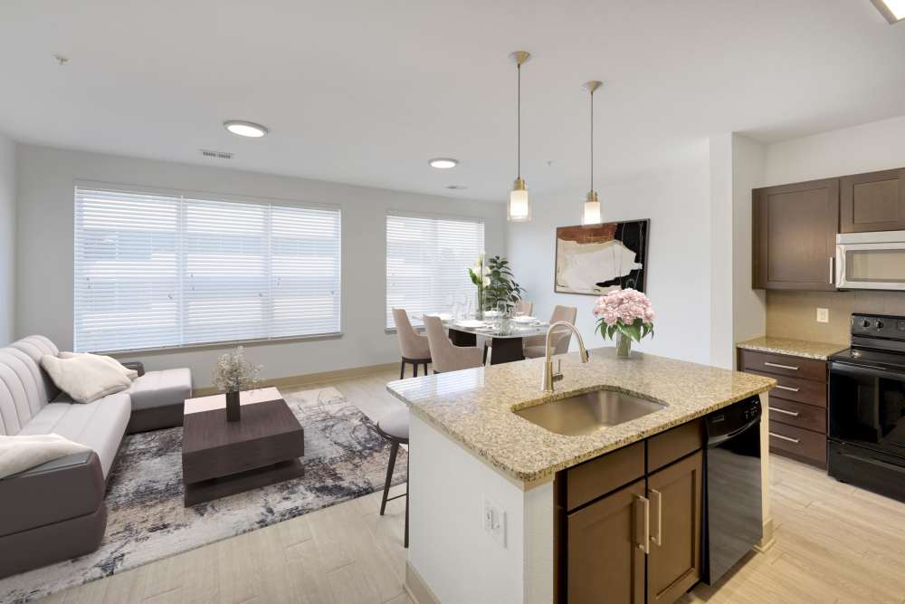 Spacious living room with access to kitchen at Helios in Englewood, Colorado