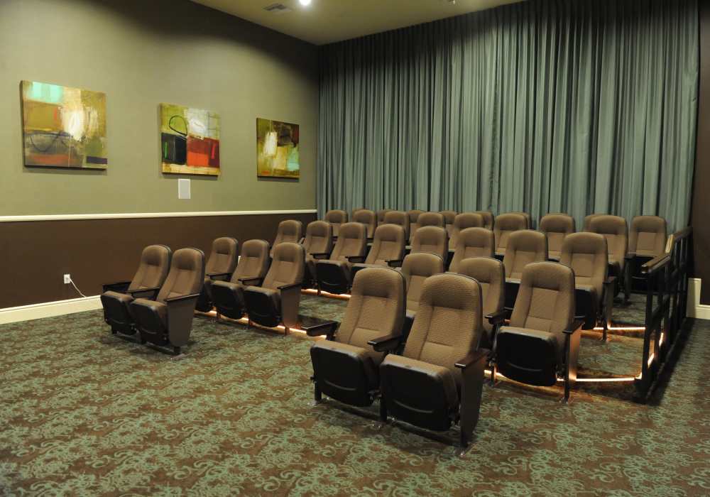 Elegant private theater with plush seating and sophisticated décor, perfect for cinematic nights and cozy gatherings at Cresta Bella in San Diego, California