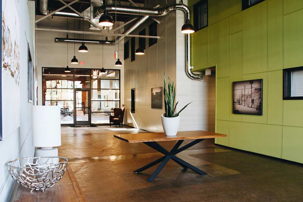 Modern lobby with stylish decor and seating at Courtyard Lofts at Scott’s Addition in Richmond, Virginia