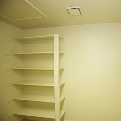 Storage shelves in the laundry area of a home at South Mesa II in Oceanside, California