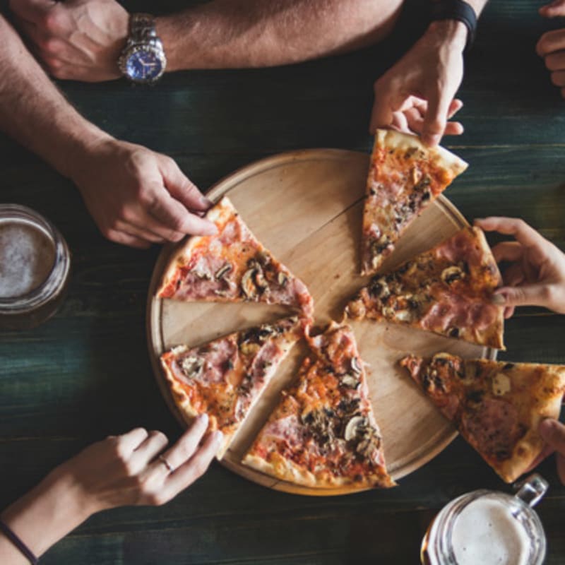 Residents eating pizza at Senita on Cave Creek in Phoenix, Arizona