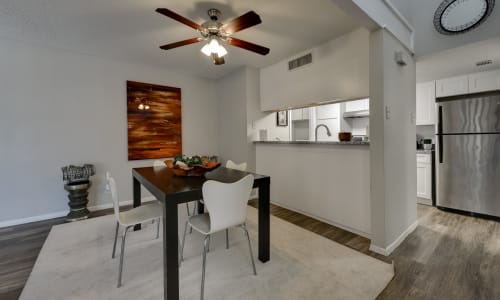 Dining room with a ceiling fan at The Fredd Townhomes in San Antonio, Texas