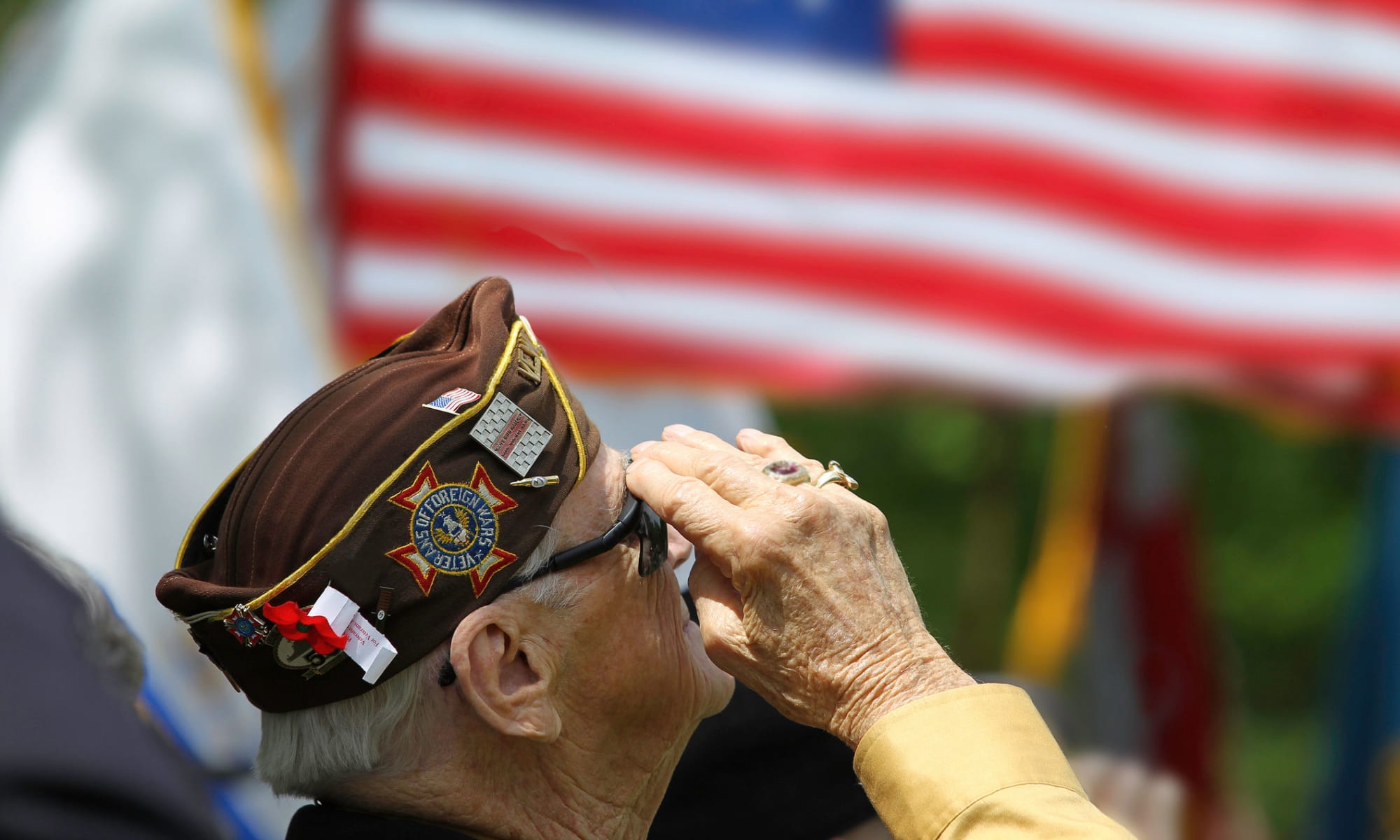 A veteran salutes the flag at Broadwell Senior Living in Plymouth, Minnesota
