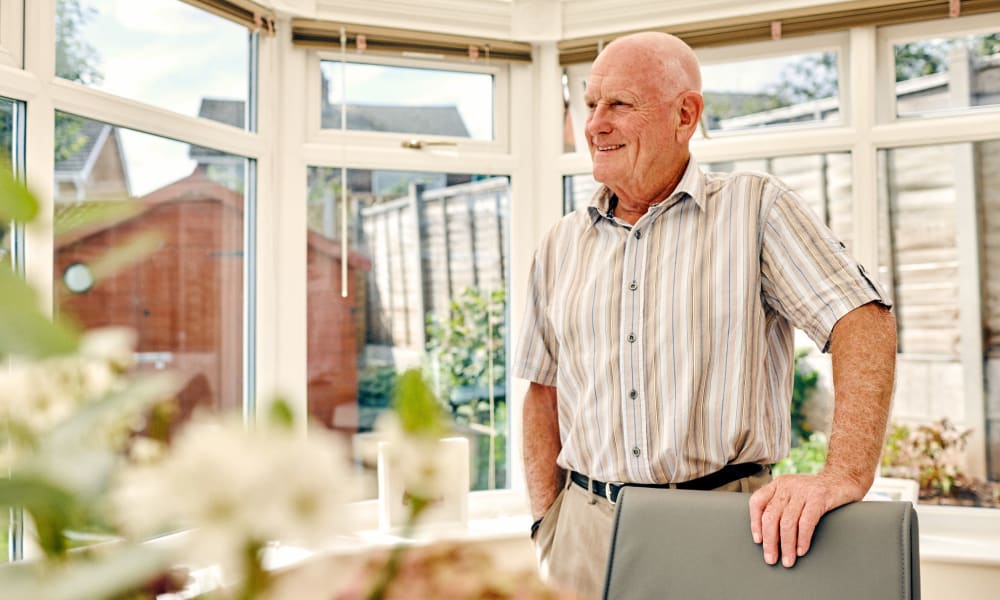 Resident Standing in a sunlit studio at Randall Residence