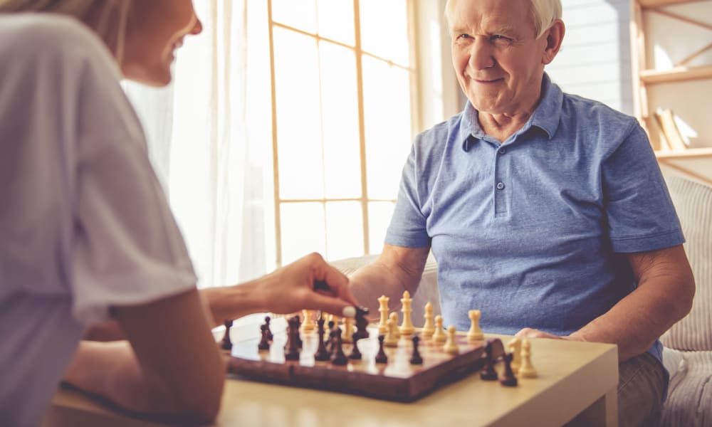 Resident and daughter plating chess at Randall Residence of Tiffin in Tiffin, Ohio