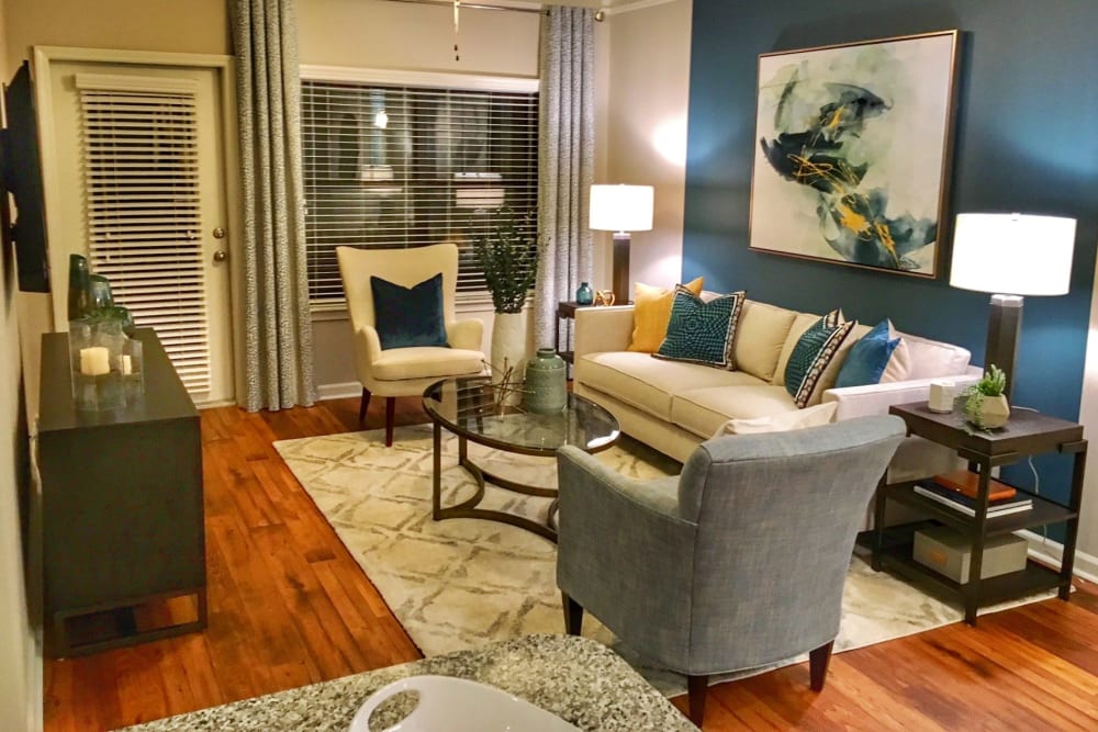 Well-furnished living space in an open-concept model home at Cahaba Grandview in Birmingham, Alabama