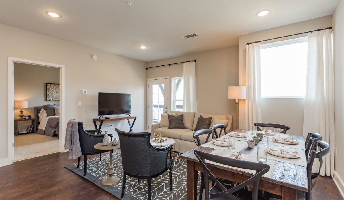 Large dining table in the open concept living room at Rivertop Apartments in Nashville, Tennessee