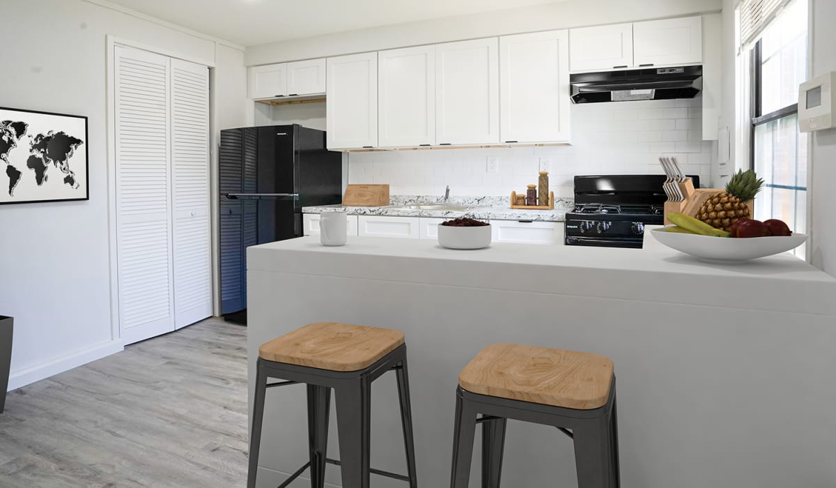 Kitchen with white cabinets at Dutch Village Apartments in Baltimore, Maryland