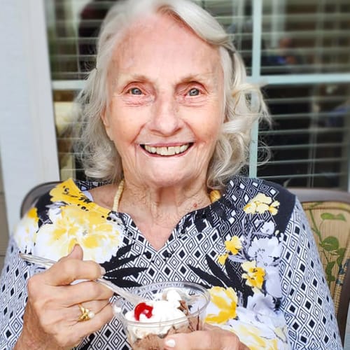 Resident eating ice cream at The Oxford Grand Assisted Living & Memory Care in Kansas City, Missouri