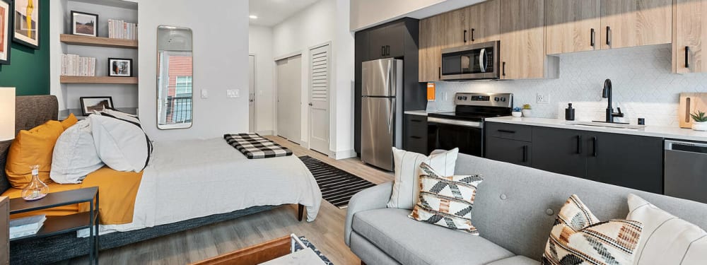 Interior of a living room with view of the lake at Radiate in Redmond, Washington