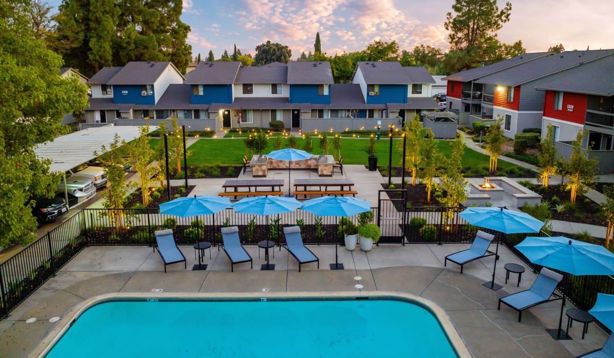 Outdoor pool with seating at  The Mews At Dixon Farms in Dixon, California The Mews At Dixon Farms in Dixon, California