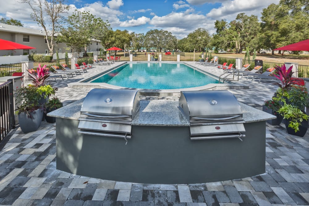 Outdoor grills by the pool at Barrington Place at Winter Haven in Winter Haven, Florida