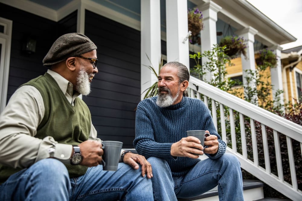 Men sitting outside at Creekside Village Senior Apartment Homes in Pittsburg, California